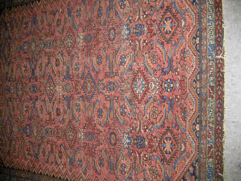 Appraisal: SHIRAZ THROW RUG The abrashed salmon field with allover angular