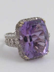 Appraisal: A white metal tests carat gold diamond and amethyst ring