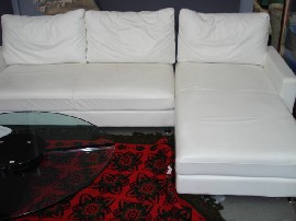 Appraisal: A pair of modern sofas in white leather