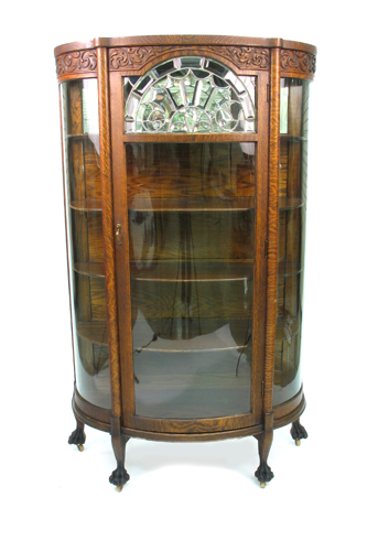 Appraisal: A VICTORIAN CARVED OAK CURVED LEADED AND BEVELED GLASS CHINA