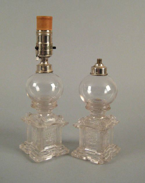 Appraisal: Pair of Massachusetts clear pressed glass oil lamps th c