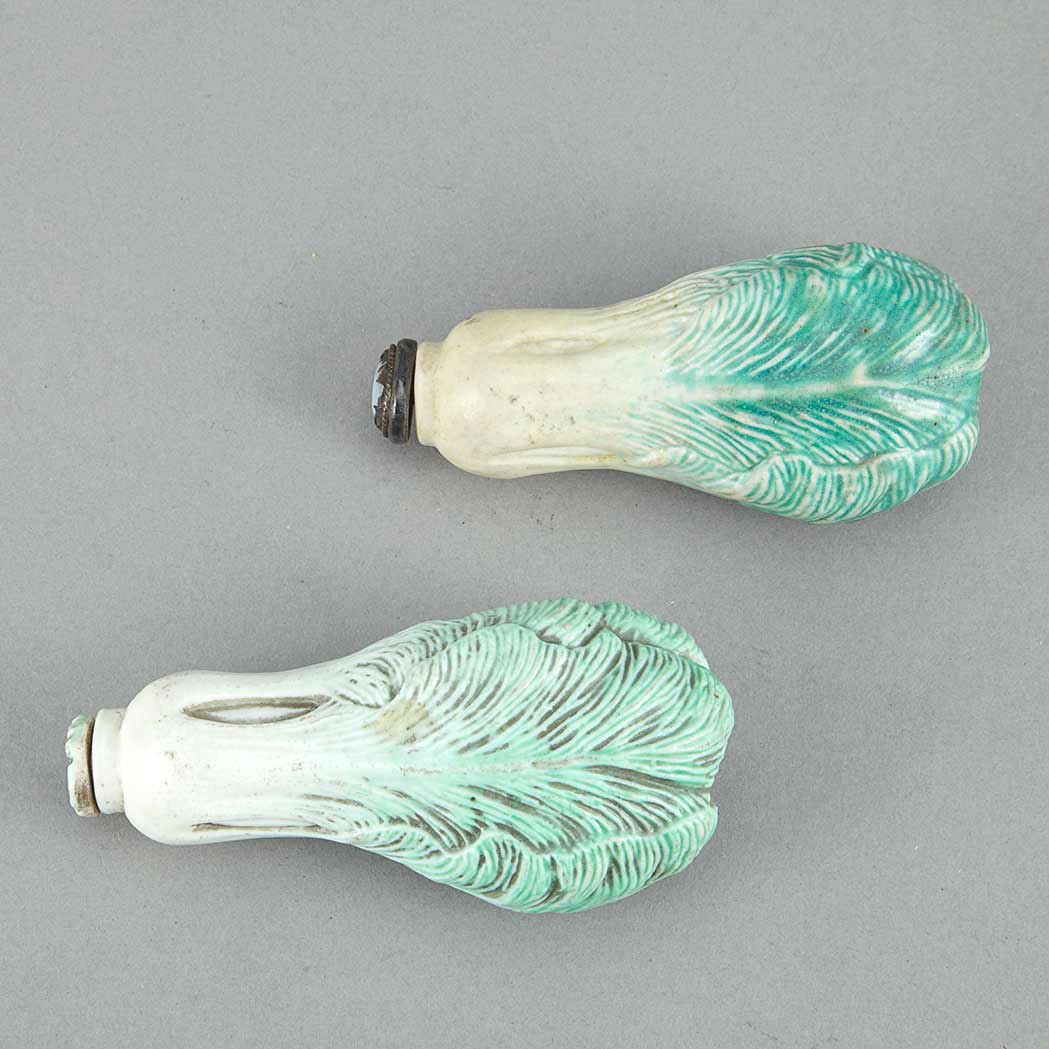 Appraisal: Two Chinese Porcelain Snuff Bottles Early th century Each molded