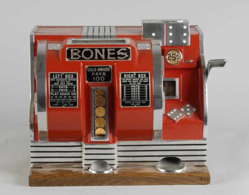 Appraisal: Buckley Bones Dice Slot Machine Description Working Similar in nature