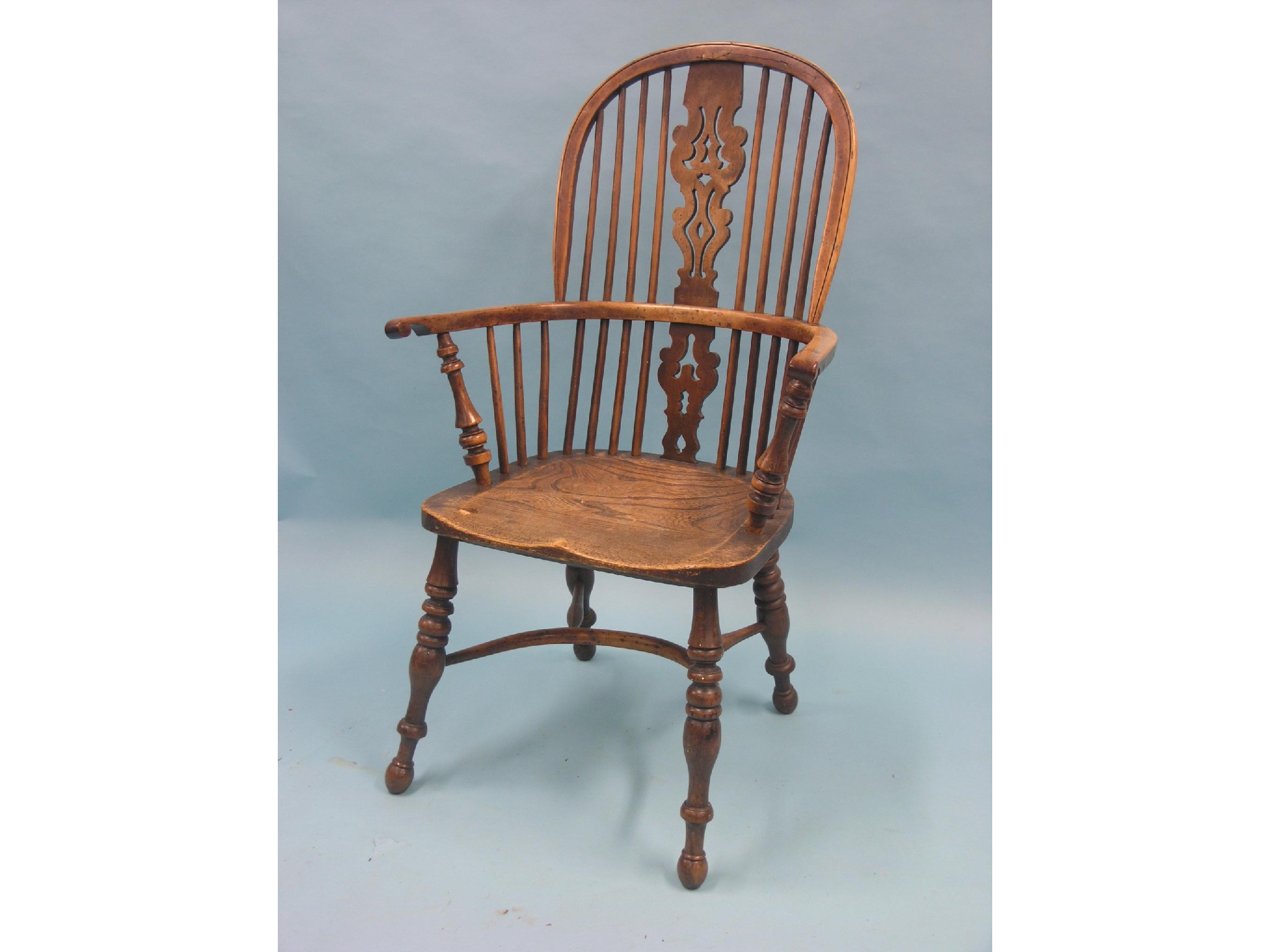 Appraisal: A Victorian yew Windsor bow-back armchair back with pierced splat