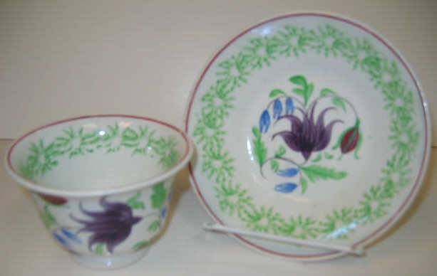 Appraisal: ENGLISH SPATTERWARE Stick spatter handless cup and saucer having green