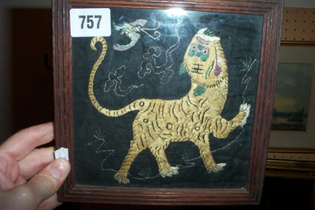 Appraisal: A small th century needlework panel of a tiger chasing