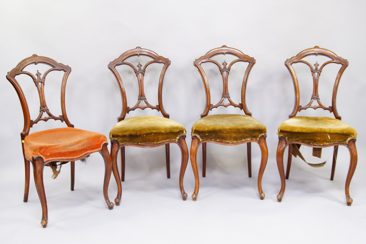 Appraisal: A set of four Victorian walnut single dining chairs with