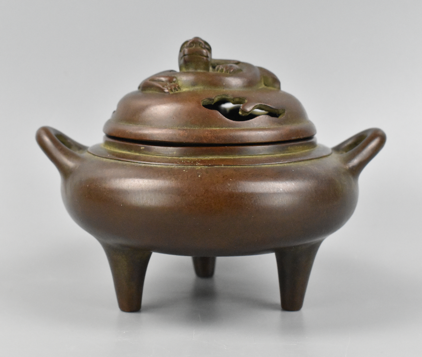 Appraisal: A Chinese bronze covered tripod censer Three long tripod legs