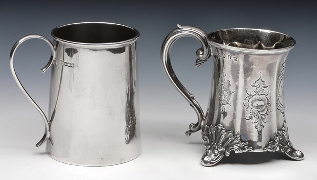 Appraisal: Victorian silver mugof waisted form with shaped handle relief scroll