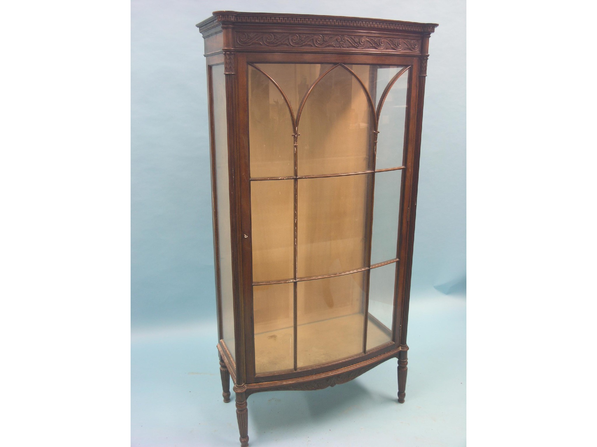 Appraisal: An Edwardian mahogany display cabinet single bow-fronted door with astragal