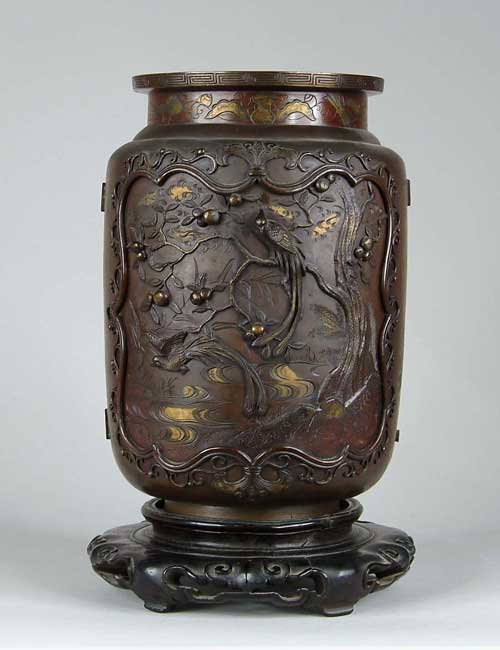 Appraisal: ORIENTAL BRONZE VASE ON STAND Bronze vase in cylinder form