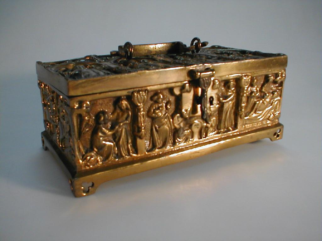 Appraisal: A brass oblong casket cast in relief with ecclesiastical classical