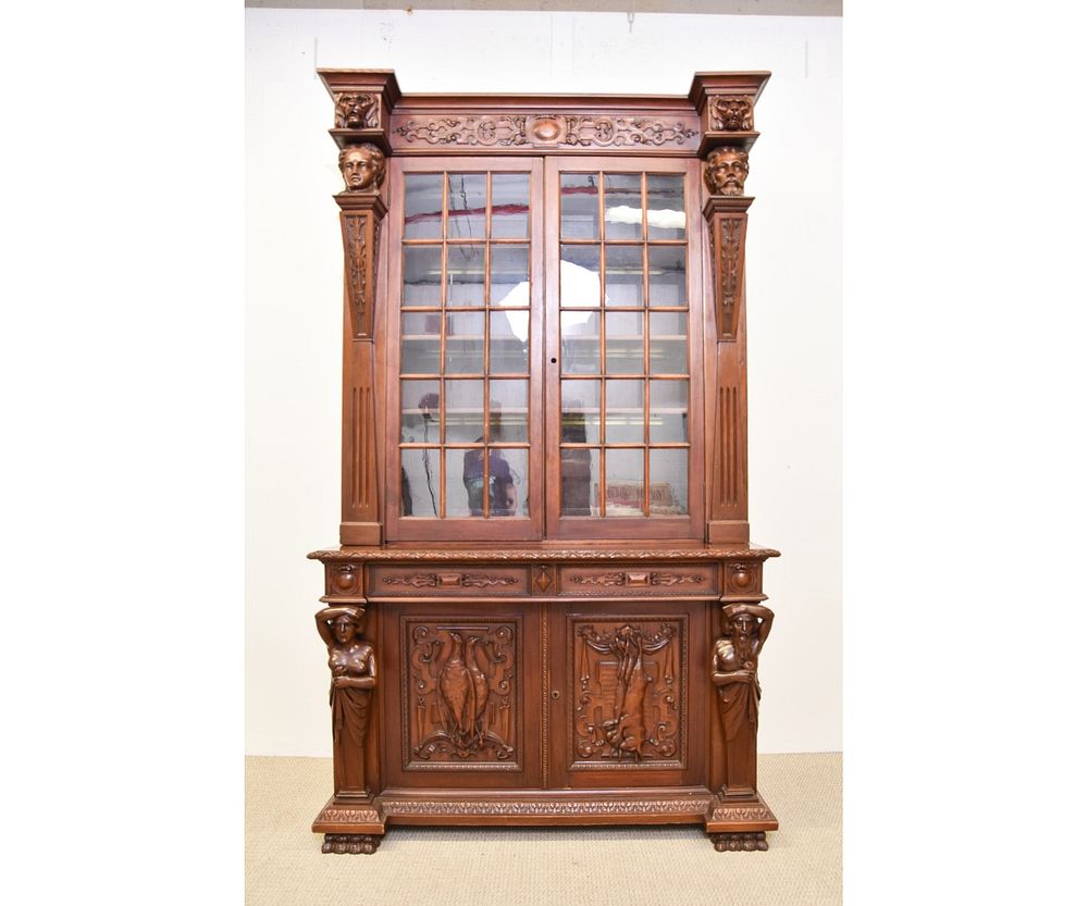 Appraisal: Massive Walnut Carved Book Case Massive walnut carved two-part book