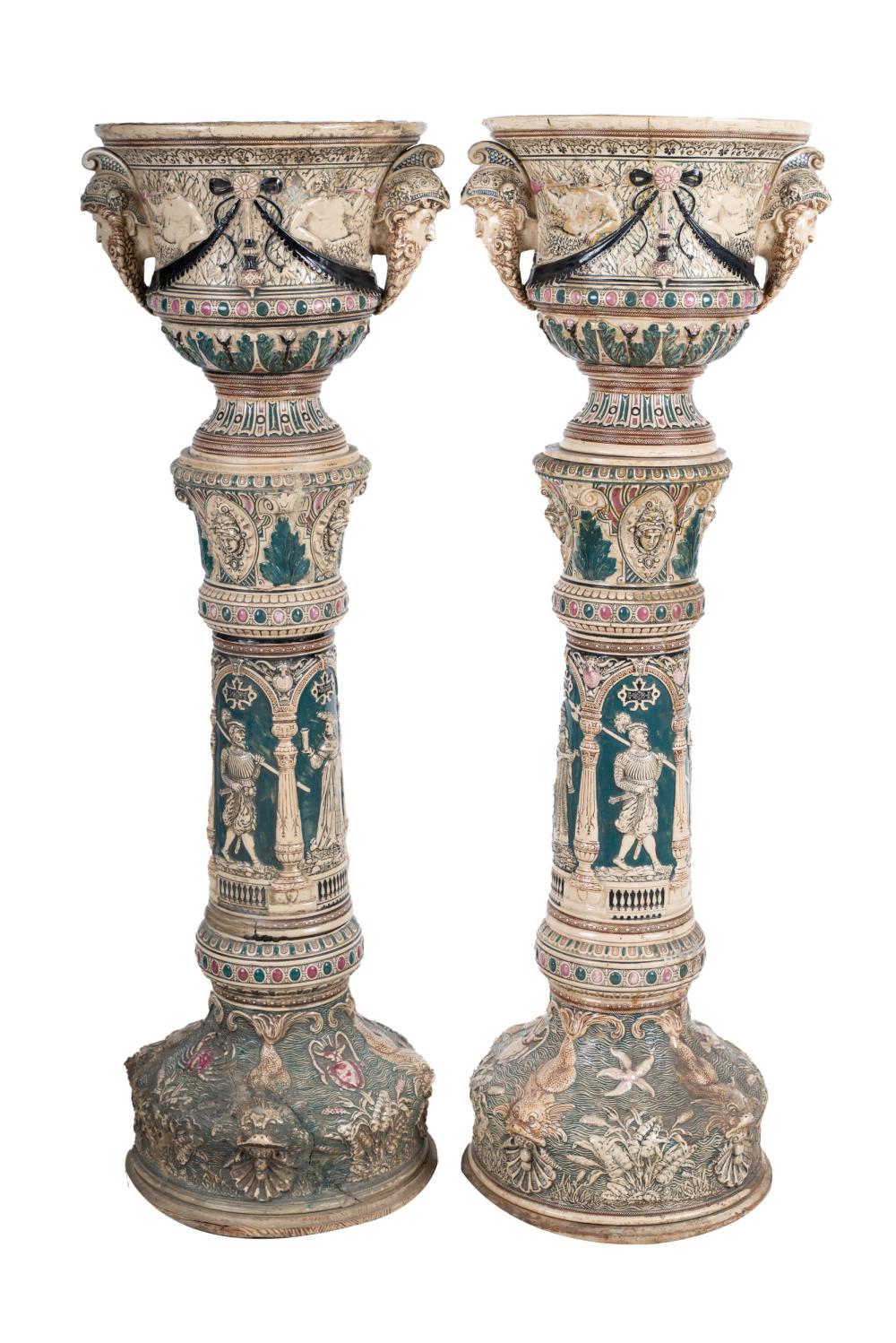 Appraisal: PAIR OF CERAMIC URNS ON PEDESTAL BASESwith majolica style decoration