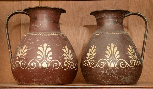 Appraisal: TWO GRADUATED AESTHETIC MOVEMENT PAINTED METAL JUGS possibly attributable to