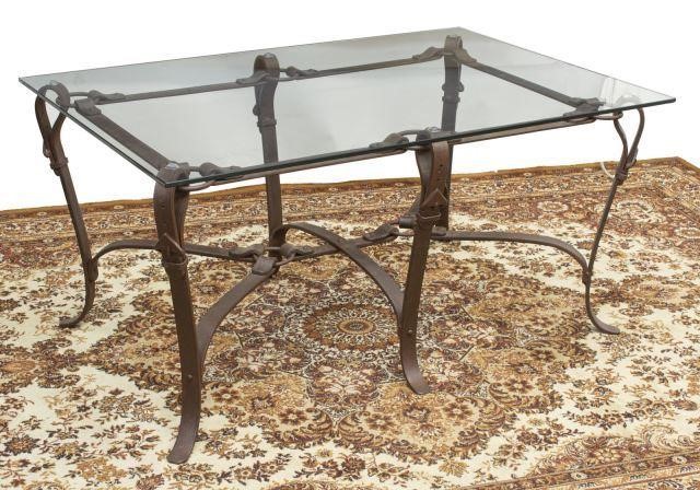 Appraisal: Rustic iron coffee table th c having rectangular glass top