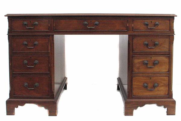 Appraisal: A George III style mahogany kneehole desk height in width