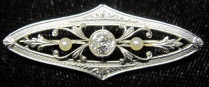 Appraisal: Platinum topped diamond pin and seed pearl pin KrementzNavette form