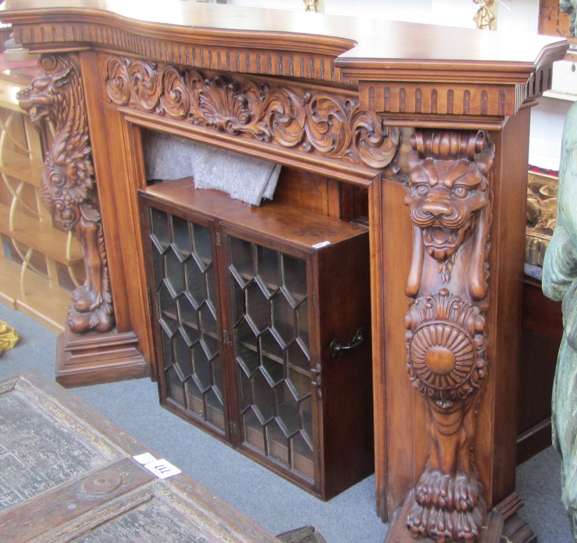 Appraisal: A th century carved hardwood fire surround the serpentine top