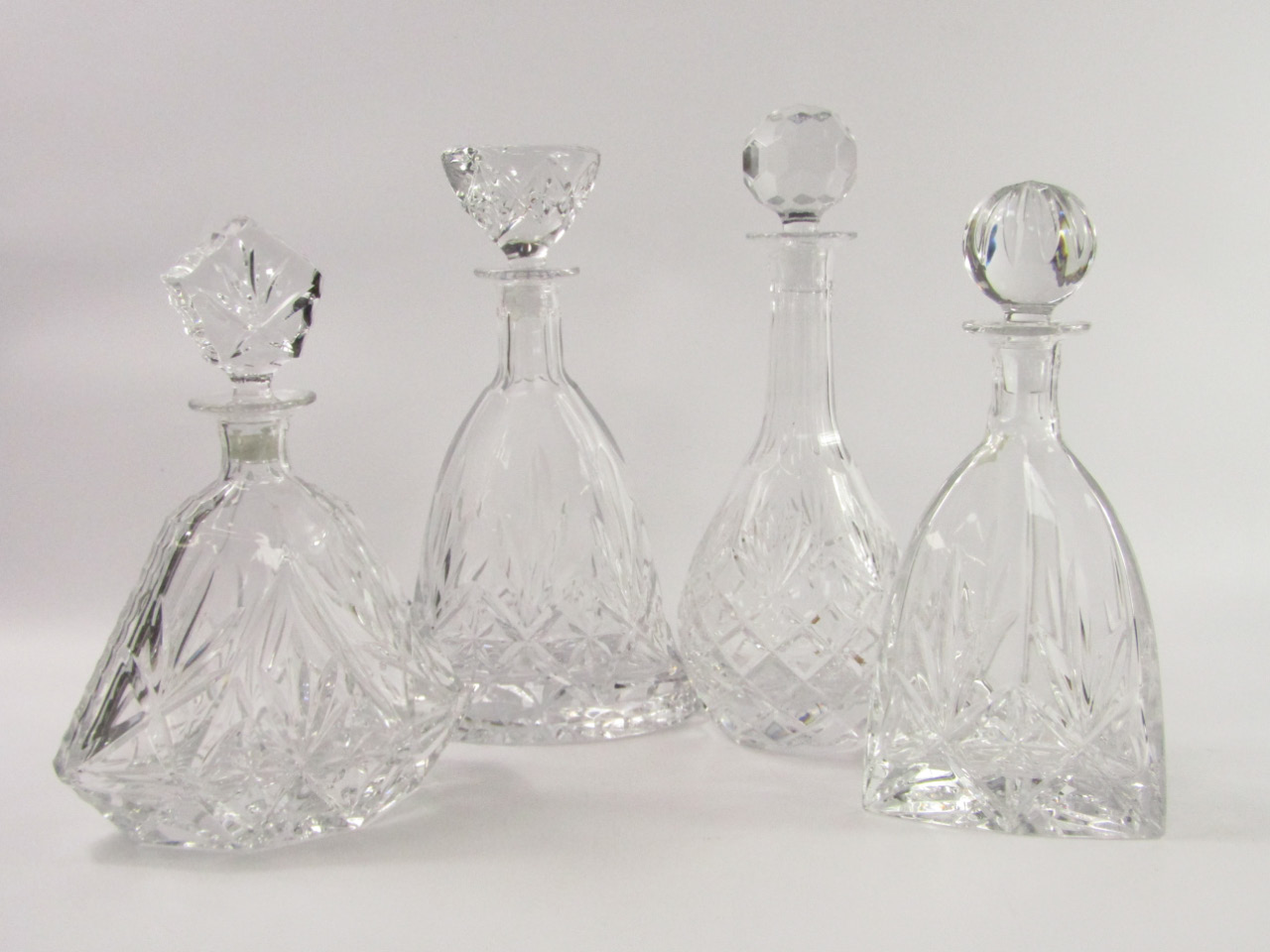 Appraisal: Four Thomas Webb crystal decanters comprising Renaissance Triangular Diamond Tall