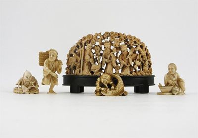 Appraisal: Four small Japanese ivory carvings of figures one with a