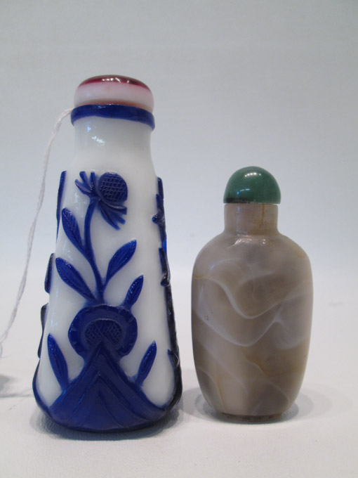 Appraisal: TWO CHINESE SNUFF BOTTLES a Peking glass bottle with blue