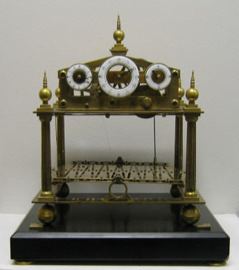 Appraisal: CONGREVE STYLE ROLLING BALL CLOCK Rare brass skeleton clock with