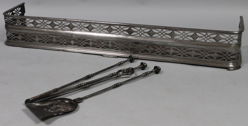 Appraisal: A thC style iron fireside companion set comprising shovel with