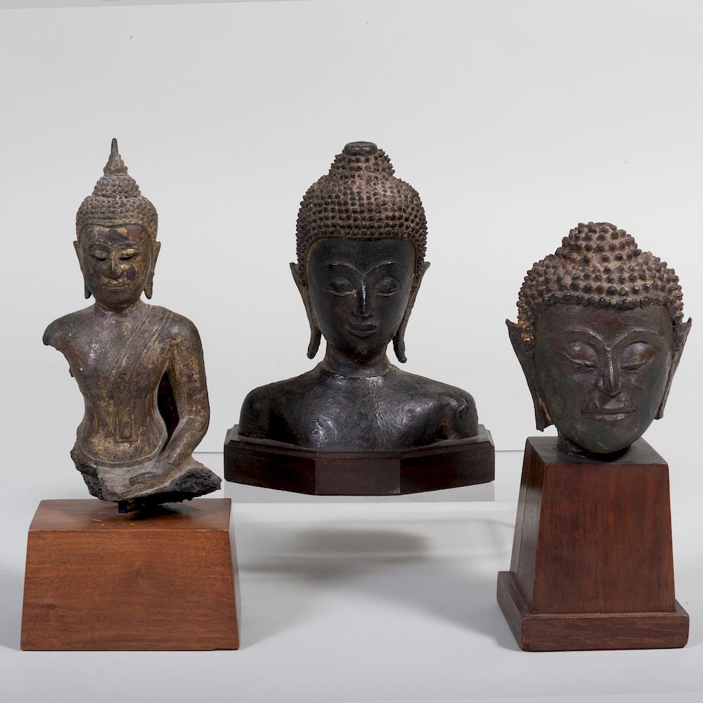 Appraisal: Three Bronze Thai Buddha Heads Each on wood bases The