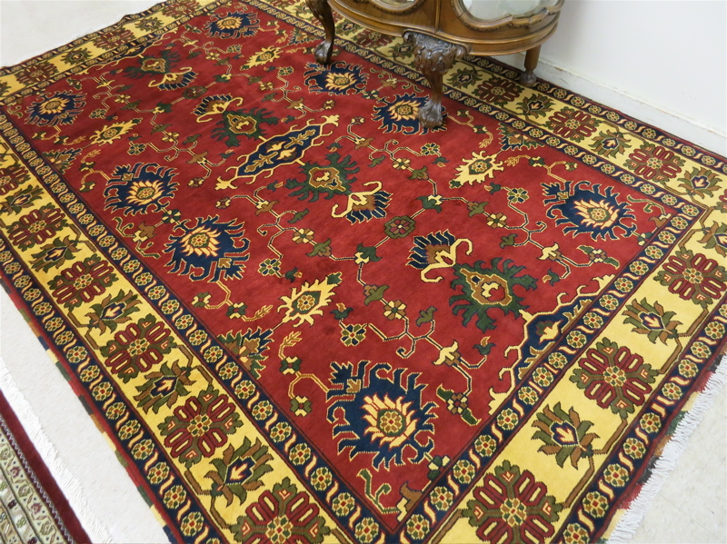 Appraisal: HAND KNOTTED ORIENTAL CARPET Pakistani Persian tribal stylized floral decoration