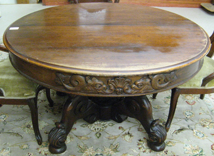 Appraisal: ROUND VICTORIAN WALNUT DINING TABLE American th century the top