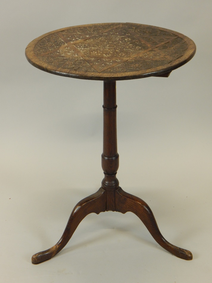 Appraisal: A Victorian oak occasional table the circular top carved with