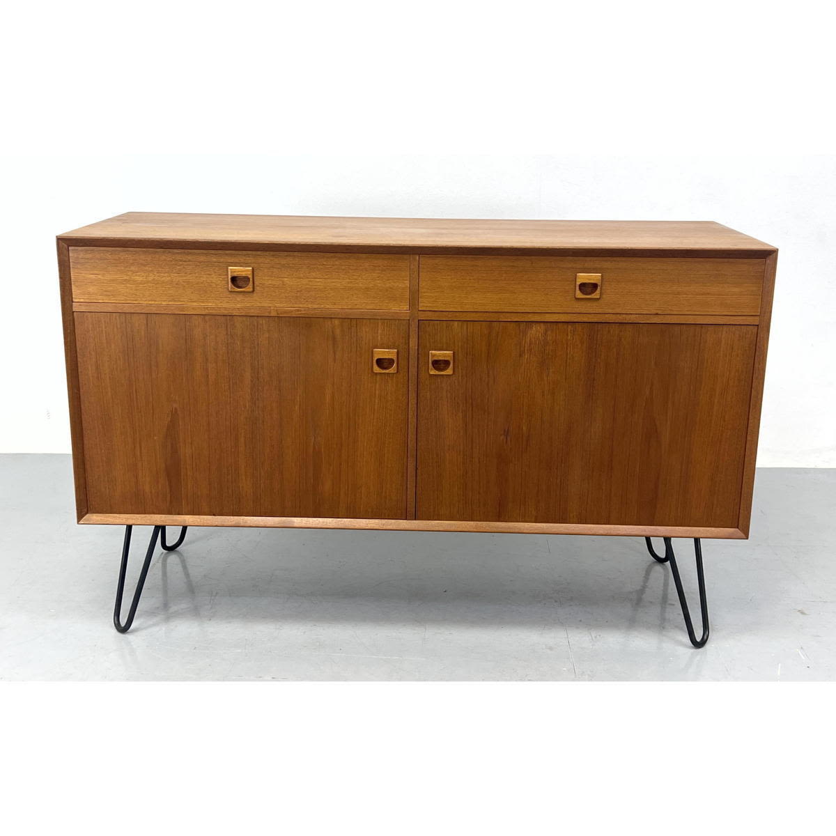 Appraisal: Danish Modern teak credenza with hair pin legs Signed on