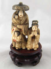 Appraisal: An early th c stained ivory group of an Oriental