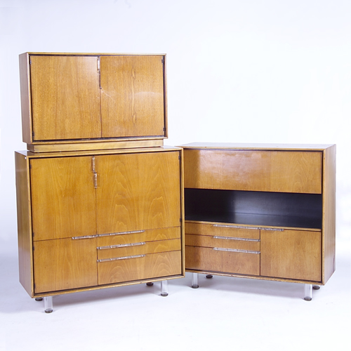 Appraisal: GILBERT ROHDE HERMAN MILLER Three inlaid walnut case pieces consisting