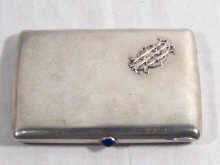 Appraisal: Russian Interest A plain silver cigarette case with blue cabochon