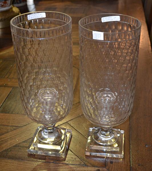 Appraisal: A PAIR OF GLASS CANDLE HOLDERS WITH FACETED STORM SHADES