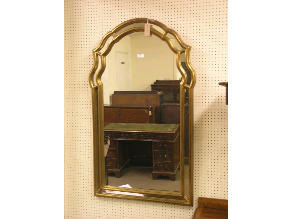 Appraisal: A gilt hall mirror arched shape with borders ft in