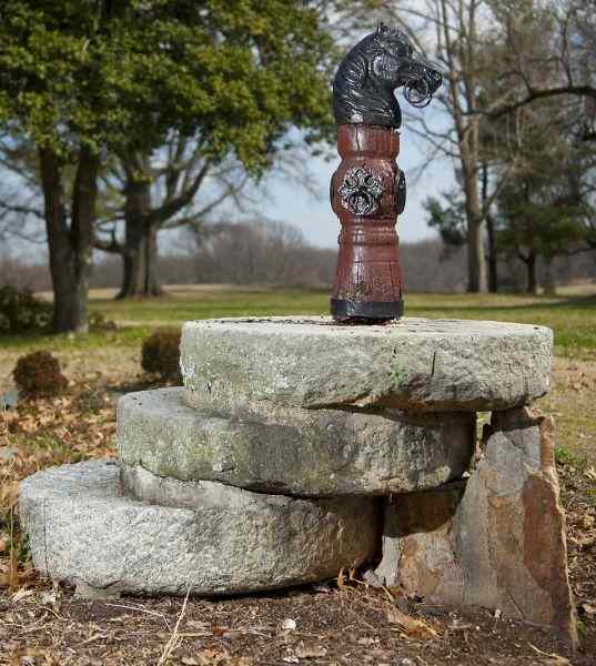 Appraisal: Horse Head Hitching Postmounted on wooden hub painted brown with