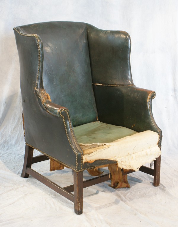 Appraisal: Leather upholstered Chippendale style wing chair rear legs repaired h