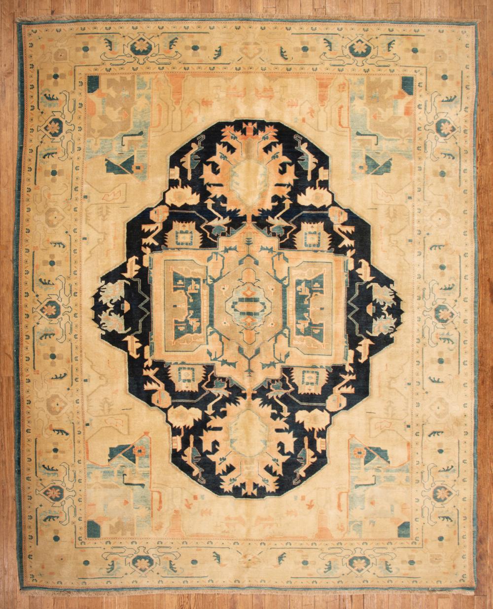 Appraisal: Persian Serapi Carpet ivory and blue ground central medallion stylized