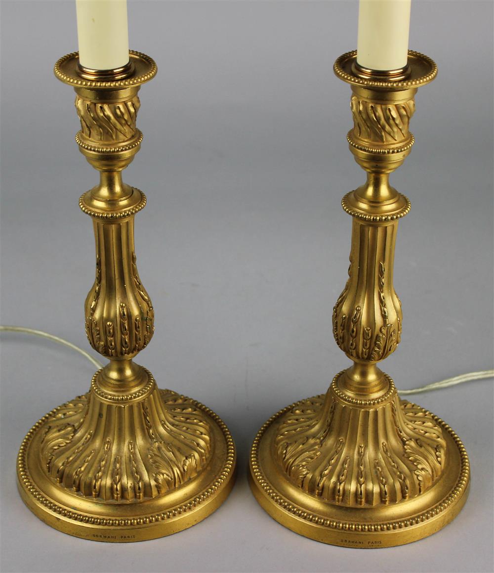 Appraisal: PAIR OF LOUIS XVI STYLE ORMOLU CANDLESTICKS IMPRESSED SORMANI PARIS