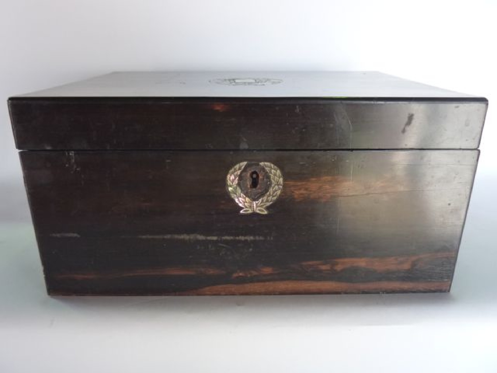 Appraisal: A th century coromandel wood box the lock escutcheon surrounded