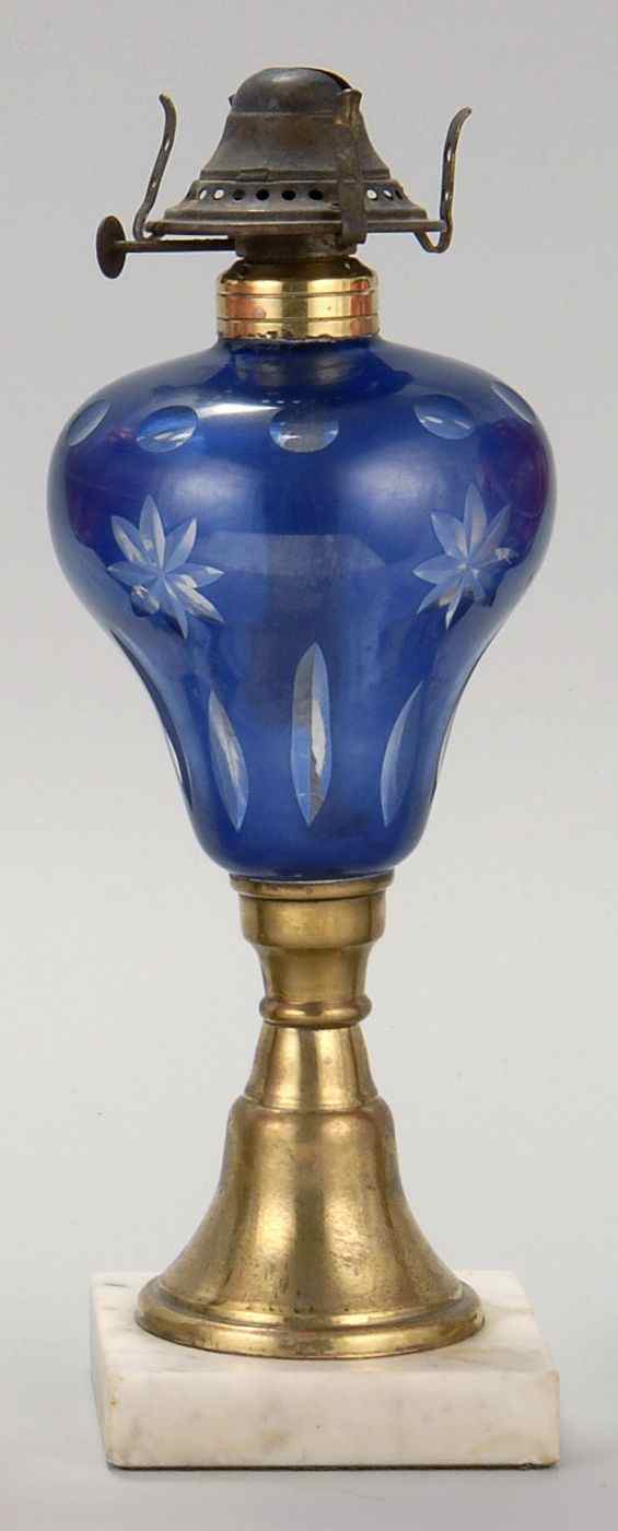 Appraisal: ANTIQUE AMERICAN GLASS OIL LAMP th CenturyDark blue-cut-to-clear font brass