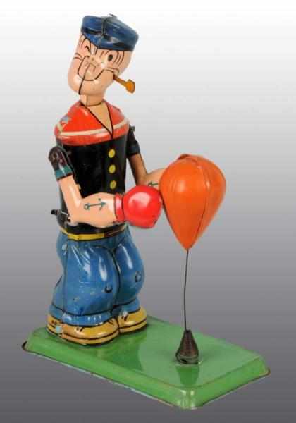 Appraisal: Tin Marx Popeye Floor Punching Wind-Up Toy Description American Working