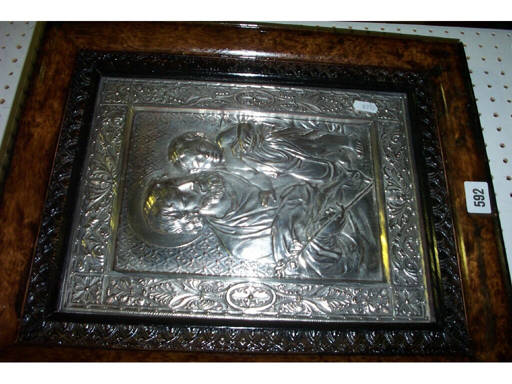 Appraisal: A silver plated relief panel showing a religious scene within