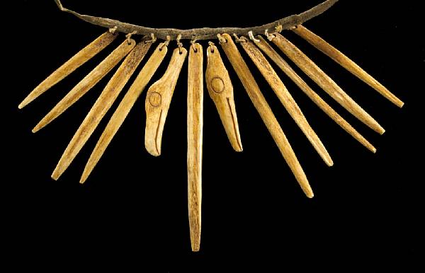 Appraisal: A Northwest Coast necklace Comprising a thin hide band and