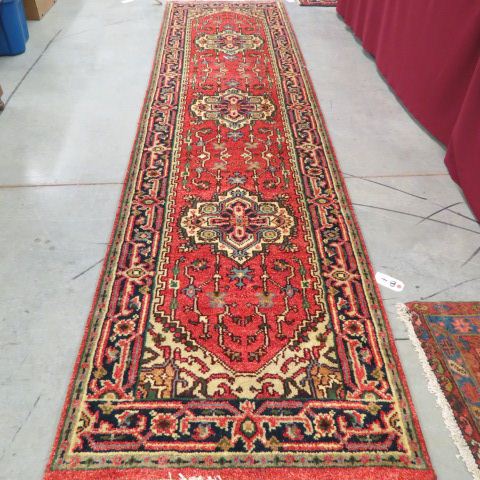 Appraisal: Heriz Persian Handmade Runner triple medallion stylized florals soft red