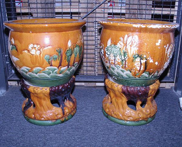 Appraisal: A pair of Chinese style amber ground glazed pottery jardinieres