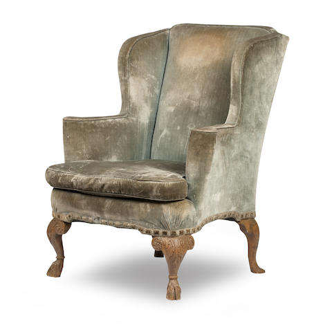 Appraisal: An Edwardian walnut-framed wing armchair In the manner of Morison